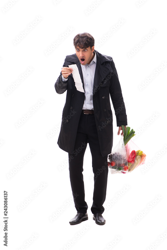Young handsome man with vegatables in shopping concept Young handsome man with vegatables in shopping concept