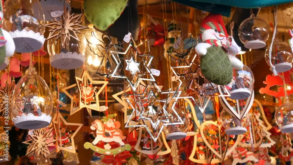 Beautiful variety of Christmas decorations from metal, wood, various shapes and sizes that sway in wind. Christmas and New Year's decor in market counter