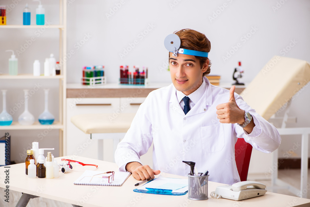 Young male doctor otolaryngologist working at the hospital Young male doctor otolaryngologist working at the hospital