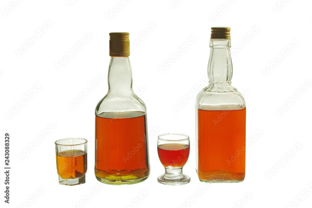 Glasses and bottles of whiskey. Isolated on white Glasses and bottles of whiskey. Isolated on white