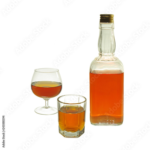 Glasses and bottles of whiskey. Isolated on white