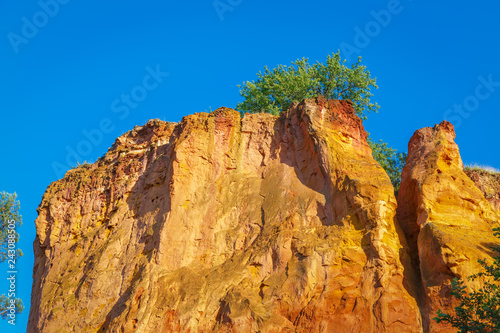.Rocks with ocher in the French city of Roussillon. Provence. France.