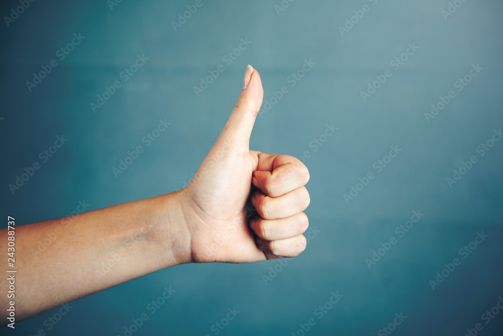 woman hand showing thumb