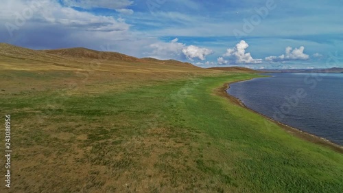 Calm Waters Of Mongolian Lake Telmen Lake Surrounded By Hills. Mongolia. photo