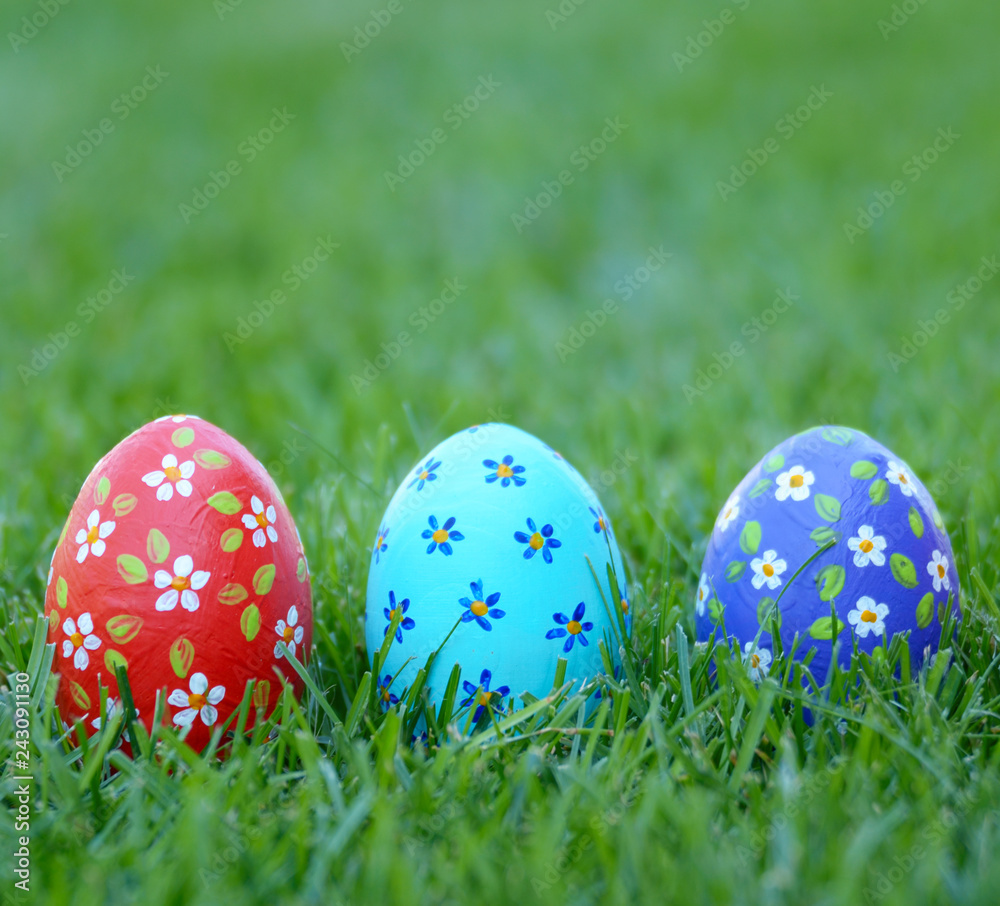 Handmade Painted Easter eggs on green spring grass. Space for text Handmade Painted Easter eggs on green spring grass. Space for text