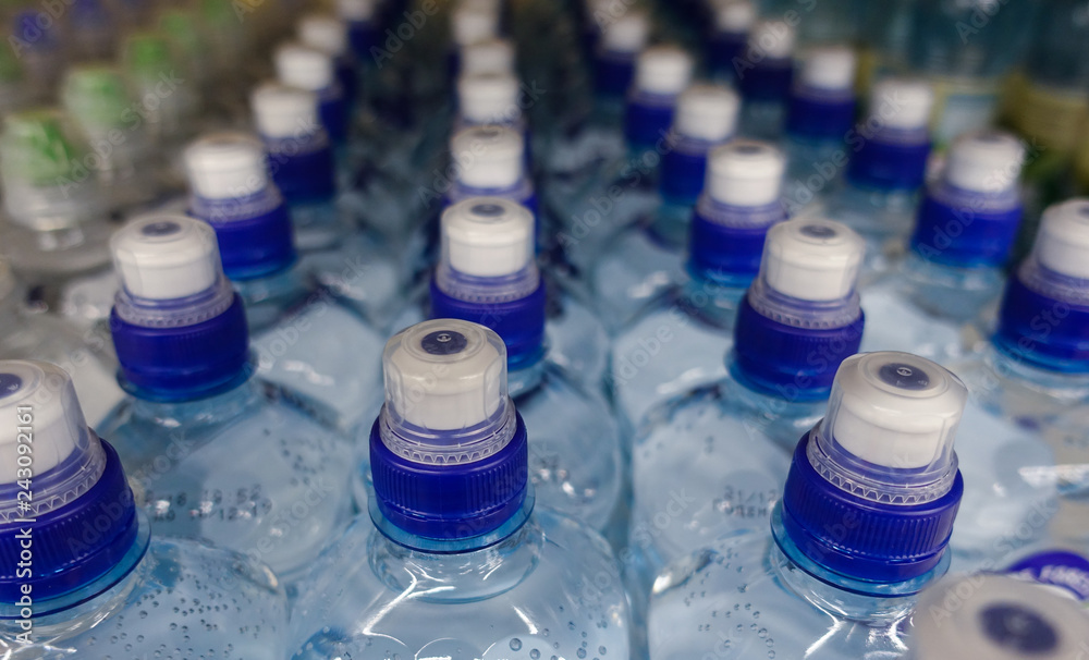 Plastic water bottles with caps of different colour Plastic water bottles with caps of different colour