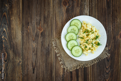 Omelet with cheese on wooden background. 