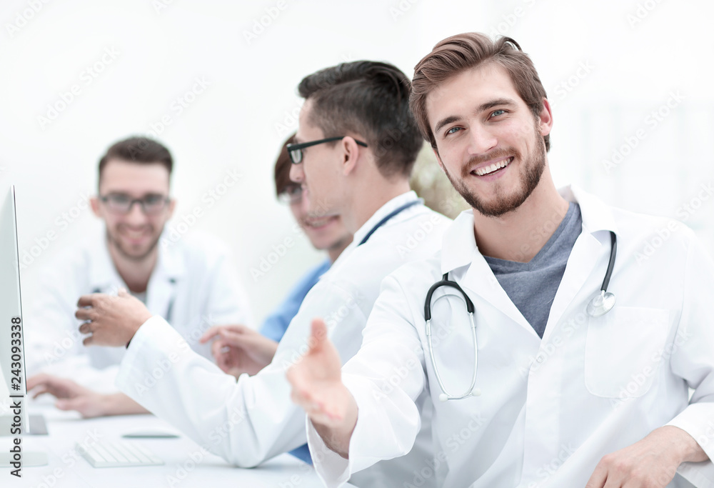 Handsome mature male doctor smiling to the camera Handsome mature male doctor smiling to the camera