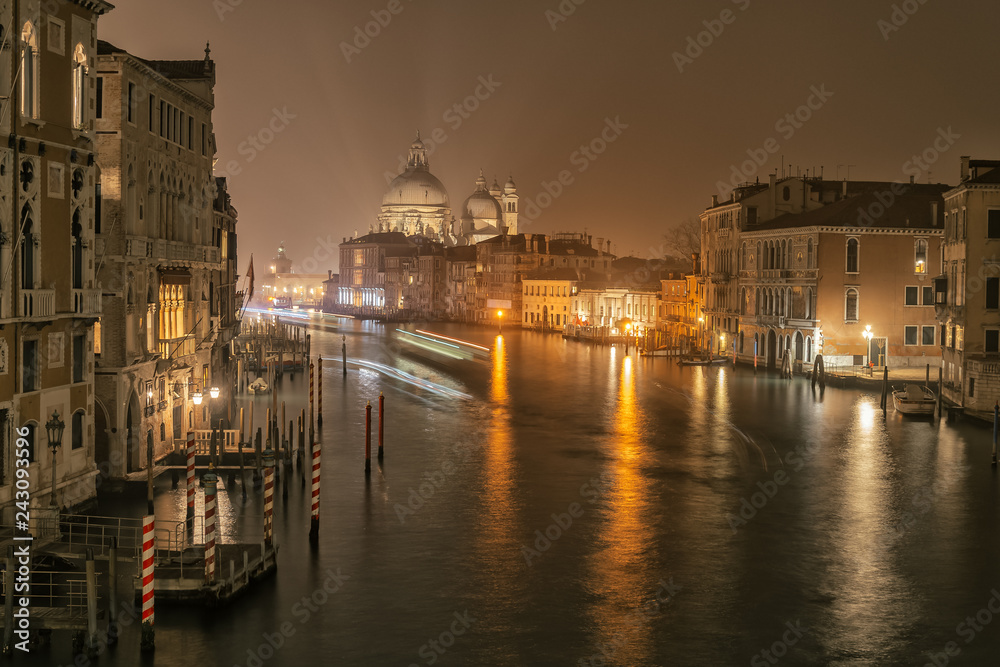 Night view on Grand Canal and basilica Santa Maria della Salute in Venice, Italy