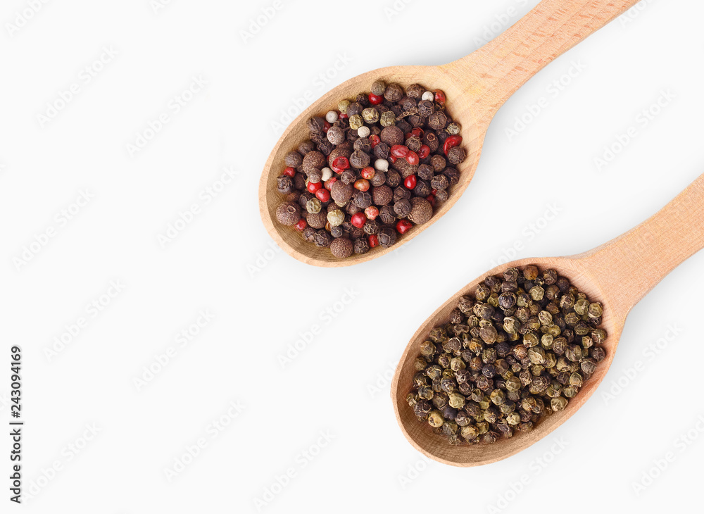 Wooden spoons with aromatic culinary condiments on white Wooden spoons with aromatic culinary condiments on white