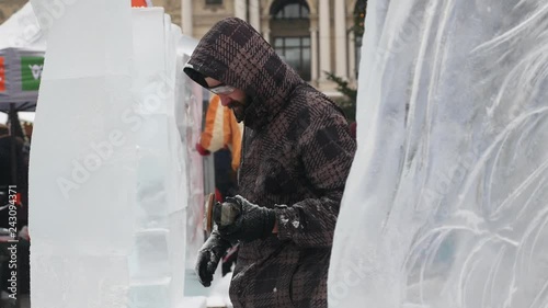 The sculptor creates an ice sculpture