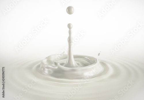 One single milk drop splashing in milk pool with ripples. photo