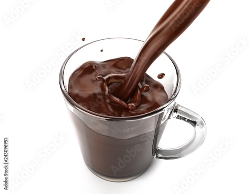 Liquid chocolate pouring in a glass mug with little splash.