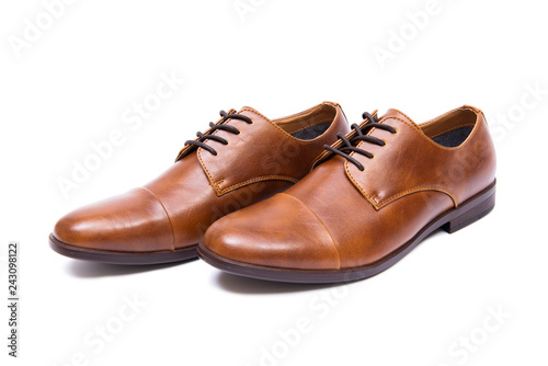 Brown shoes isolated on white background © Elnur