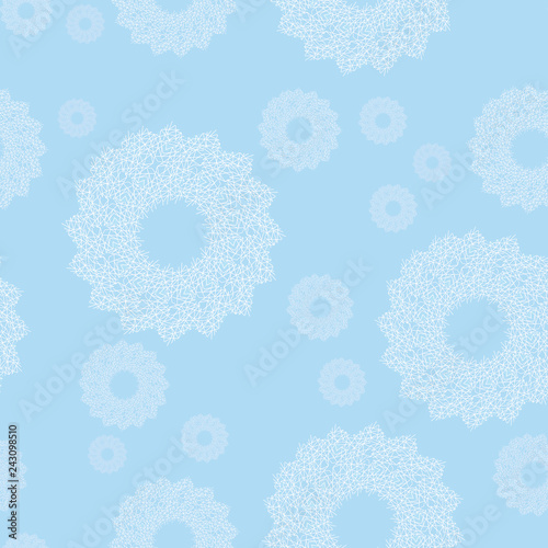 White lace snowflakes on a light blue background. Seamless pattern, winter ornament of openwork round shapes. Elegant, delicate, airy, nice, soft, cute, artistic image
