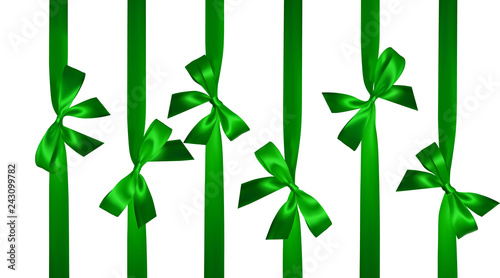 Realistic green bow with vertical green ribbons isolated on white. Element for decoration gifts, greetings, holidays. Vector illustration