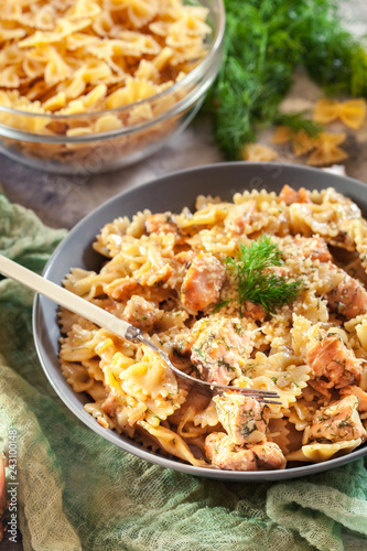 Creamy farfalle pasta with salmon, parmesan cheese and dill