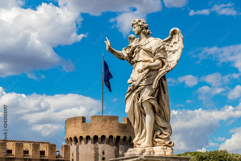 Statue of an angel on the background Castle Sant'Angelo and flag of european union, Rome, Italy