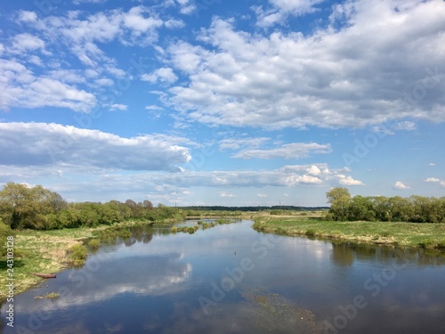 Scenic view of a river in Belarus under blue skies 
