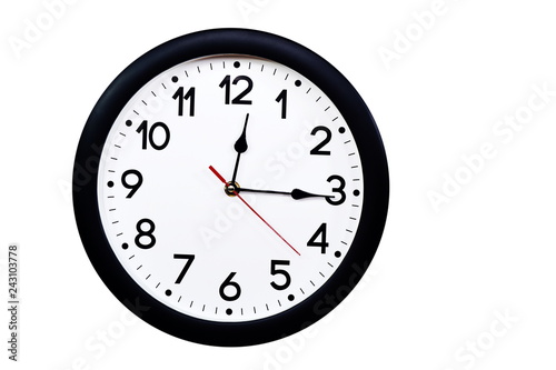 Time concept with black clock at a quarter past noon