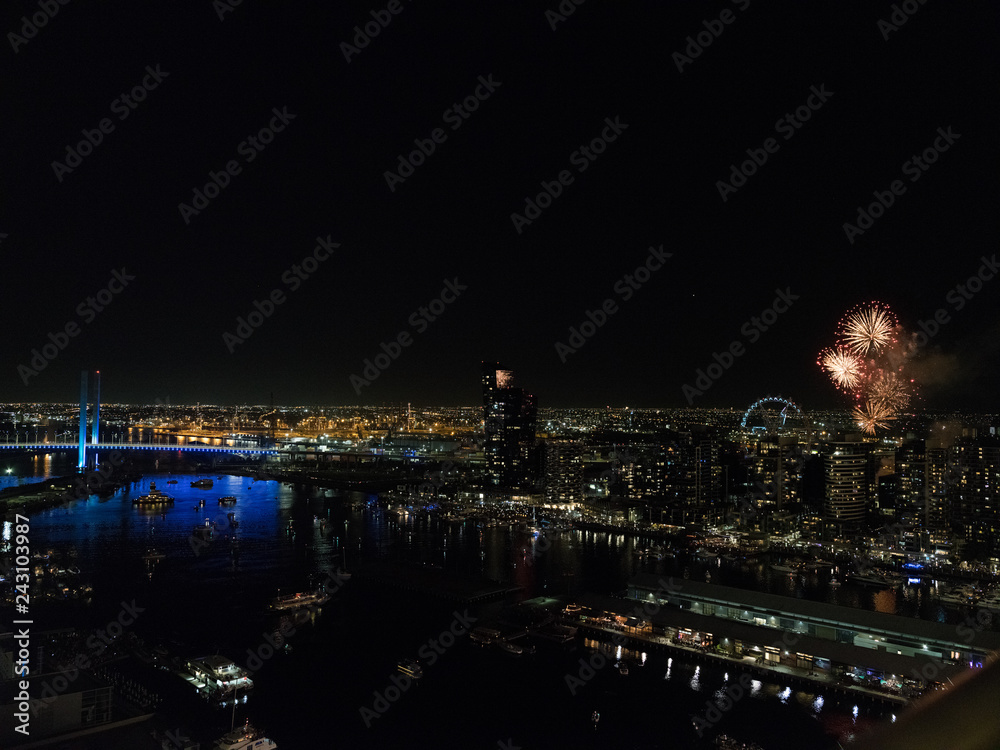 Melbourne city skyline at night and fire work