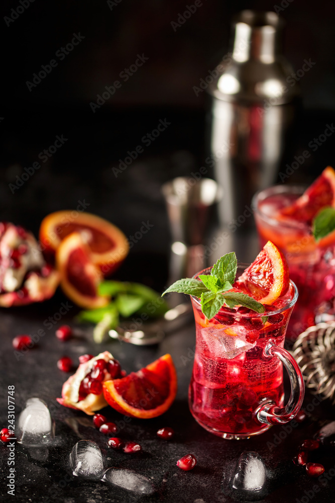 Red cocktail with blood orange and pomegranate.