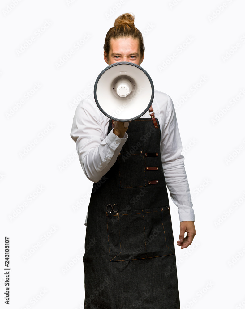 Barber man in an apron shouting through a megaphone to announce something on isolated background Barber man in an apron shouting through a megaphone to announce something on isolated background