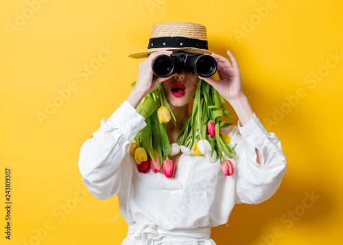 woman with springtime tulips instead hair and bonocular photo