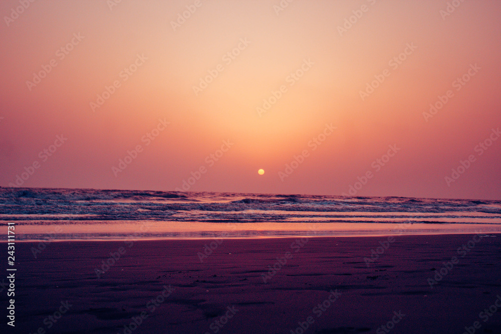a beautiful sunset over the beach side 