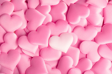 Valentine's Day. Holiday abstract pink Valentine background with satin hearts. Love concept