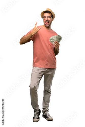 Man holding many bills showing tongue and taking out the horns on isolated white background