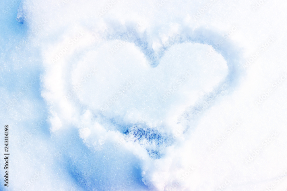 The shape of heart on the snow. Closeup shot. The shape of heart on the snow. Closeup shot.