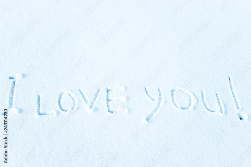 Love in the winter on the snow, the inscription on the snow.