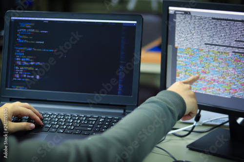 Developing programming technology and coding website design to be a data center. Programmers are checking the code for the correct functioning of the developing program.