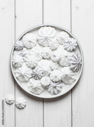 Dessert with white meringue on white background