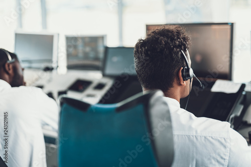 Young air dispatcher monitoring in navigation room