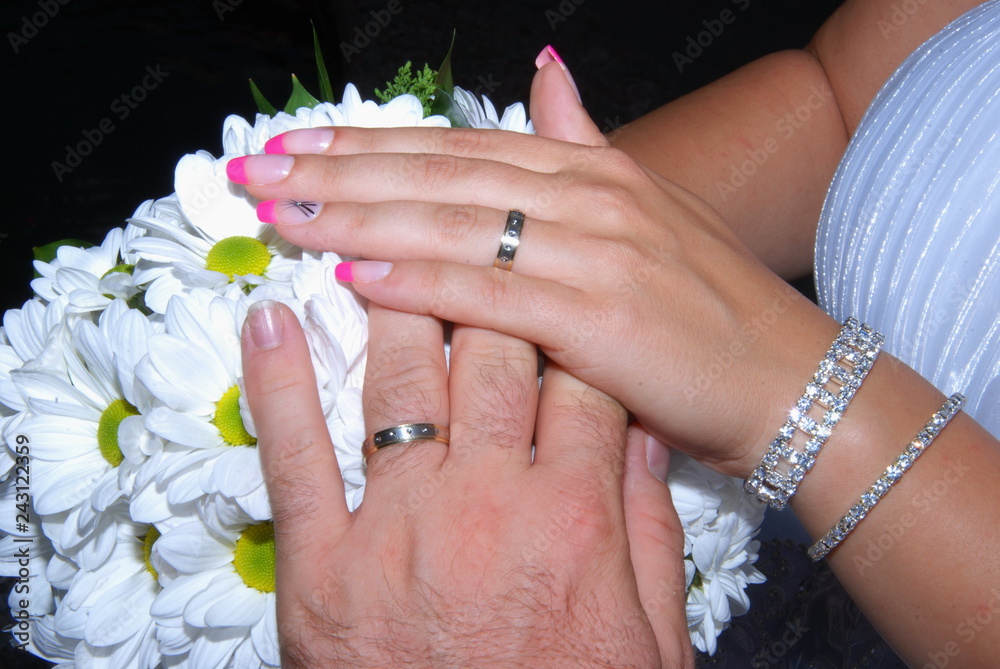 Fototapeta premium Newlywed hands with rings