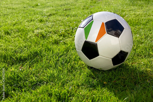 Football on a grass pitch with Republic of Ireland Flag