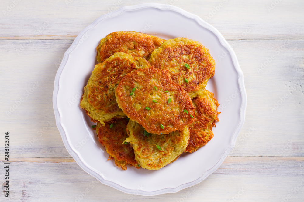 Potato pancakes. Vegetable fritters, latkes, draniki - popular dish in many countries Potato pancakes. Vegetable fritters, latkes, draniki - popular dish in many countries
