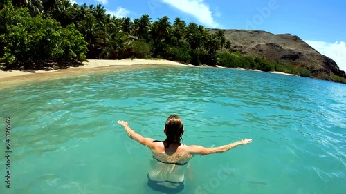 Tahuata Marquesas young female on deserted ocean beach photo