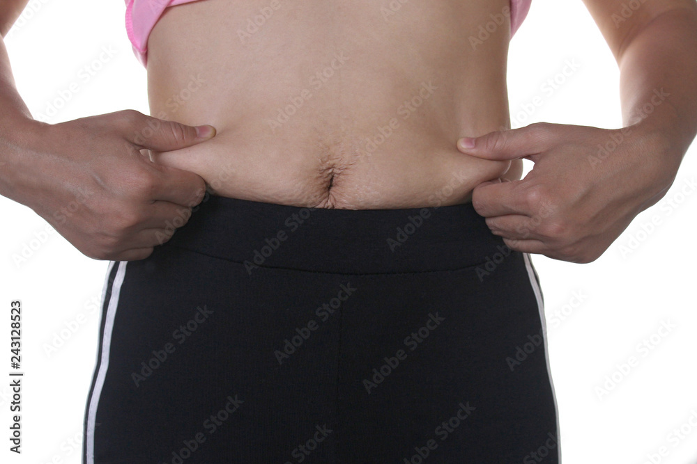 Naklejka premium Asian fat women has overweight. she used hands squeezing excess fat of the abdomen. isolated on white background. 
