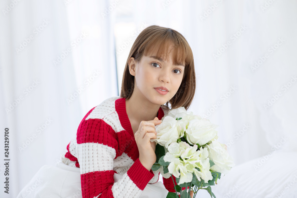 Beautiful Asian woman smile and holding flower or bouquet feeling so happiness and cheerful Beautiful Asian woman smile and holding flower or bouquet feeling so happiness and cheerful