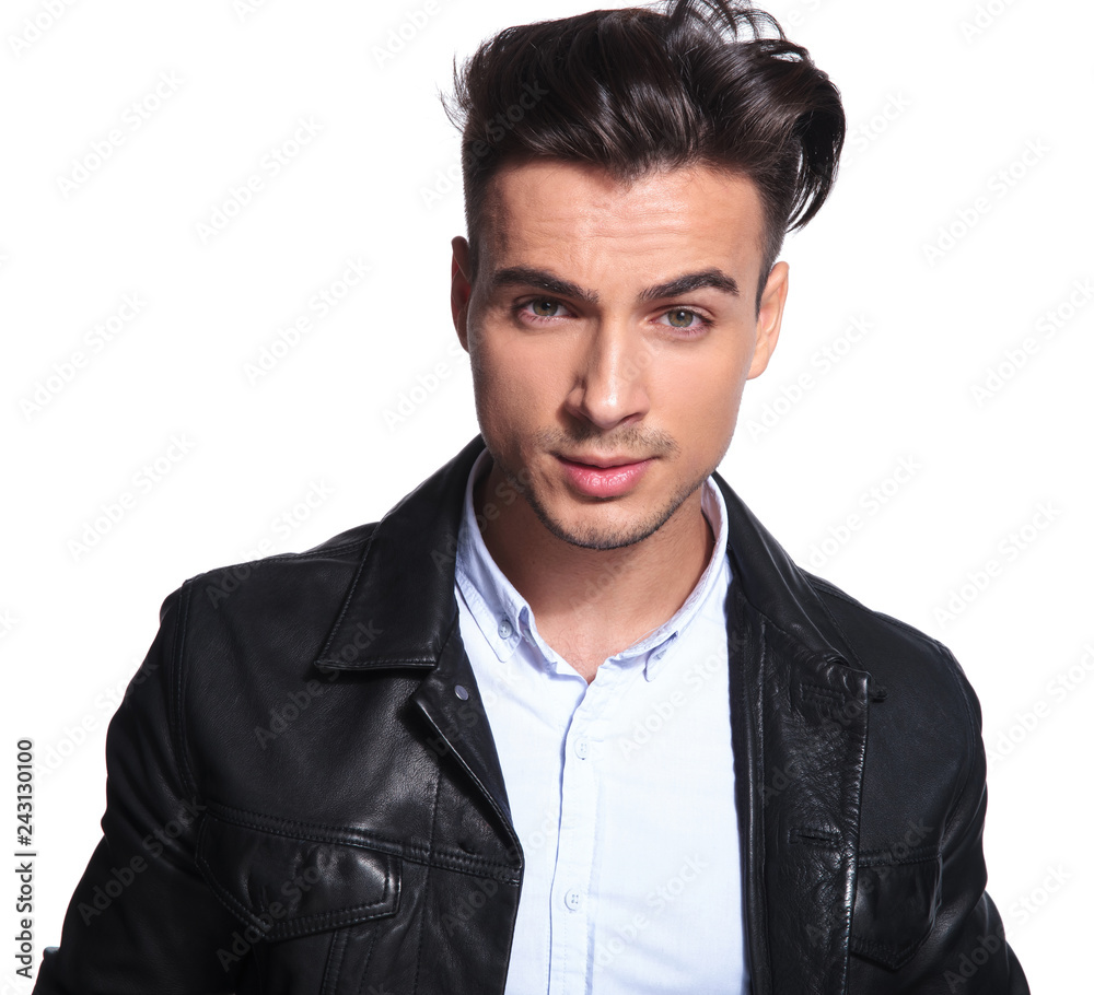 Obraz premium young smart casual man wearing leather jacket and shirt