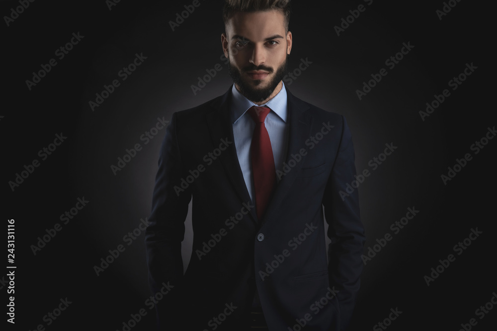 portrait of relaxed smart casual man standing with hands in pocket portrait of relaxed smart casual man standing with hands in pocket