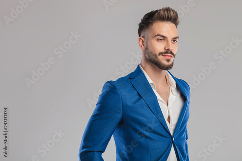 Quadro su tela portrait of proud unshave businessman looking to side