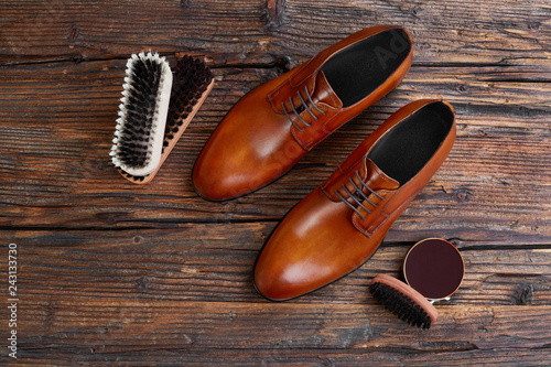 Men shoes and care products on wood