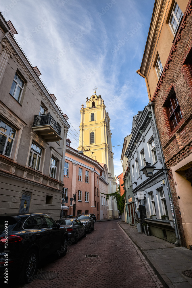 Old narrow Street in Vilnius citycenter, Lithuania. View on old colorful buildings in Vilnius.