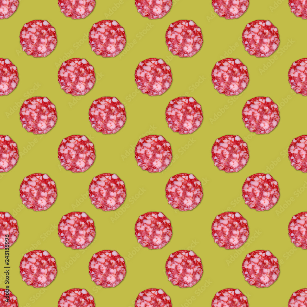 Salami sausage slices background. Close up. Slices of smoked sausage. Food background. Focus on center.