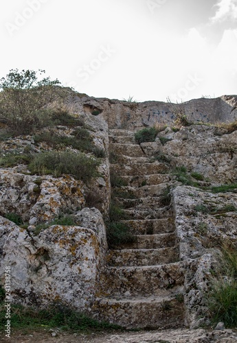 Stairs carved in the rock at the hill near Acropolis.