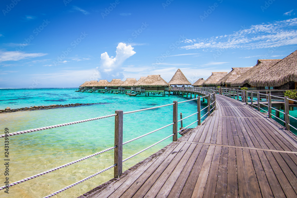 Luxury travel vacation and honeymoon concept with overwater bungalow villas. Moorea, Tahiti, Bora Bora in French Polynesia.